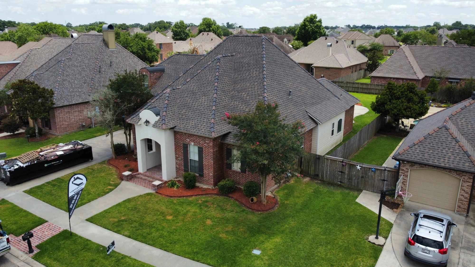 Aerial view of a finished single-story Louisiana home with a new dark architectural-shingle roof